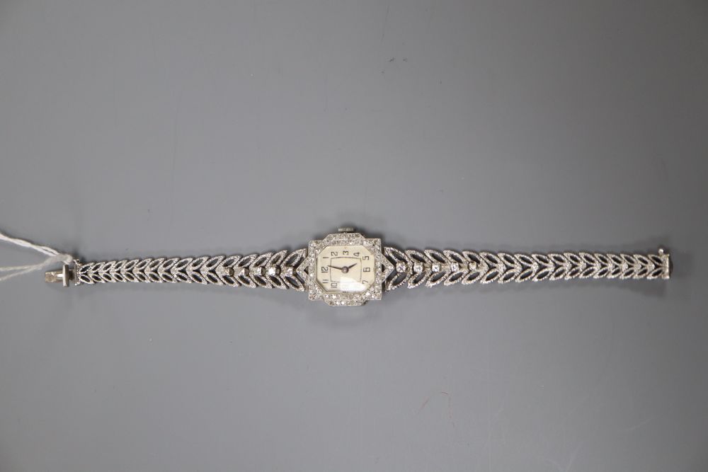 A ladys 18ct white gold and diamond set cocktail watch with diamond set bracelet, length 16cm, gross 33.3 grams.